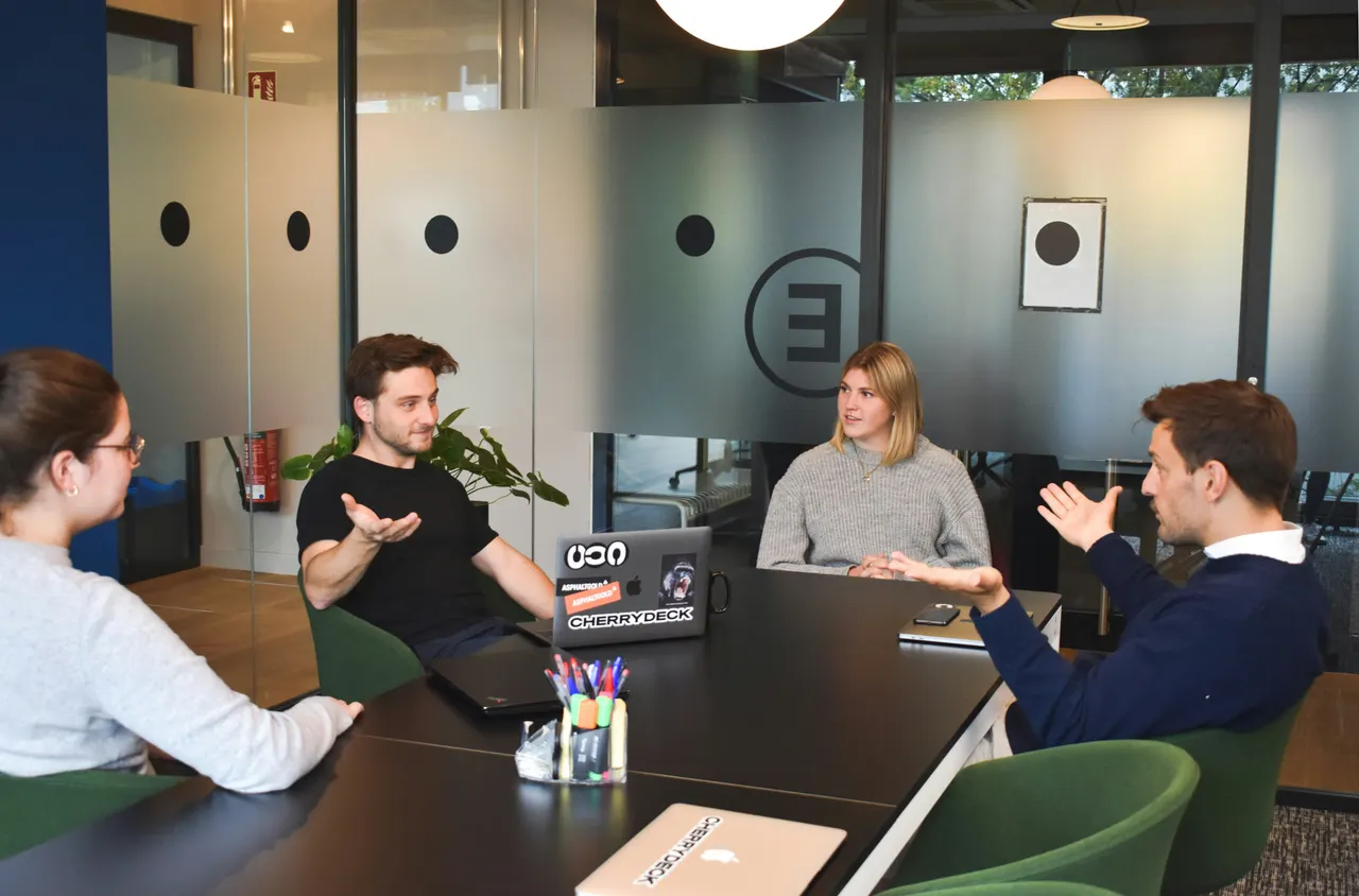 Small team discussing a project around a table