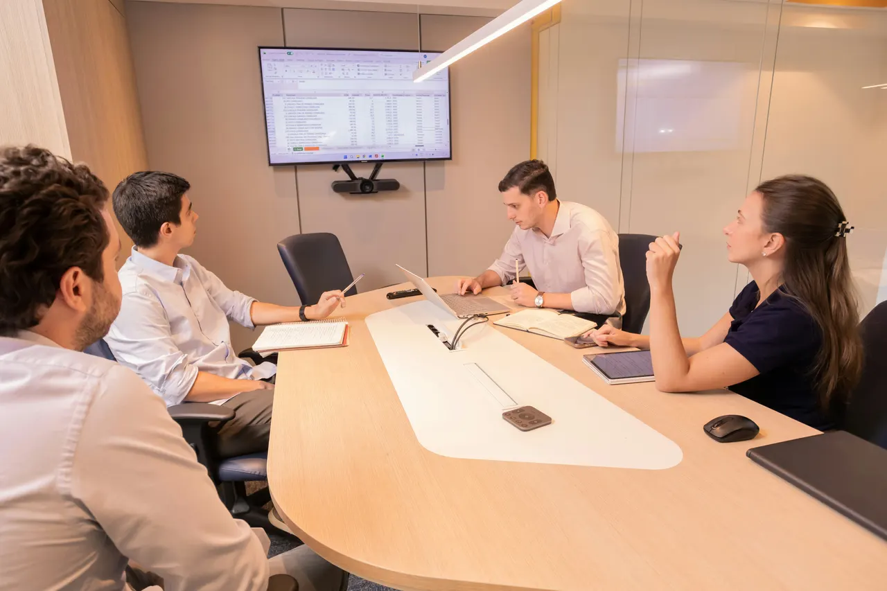 Founders planning around a meeting table